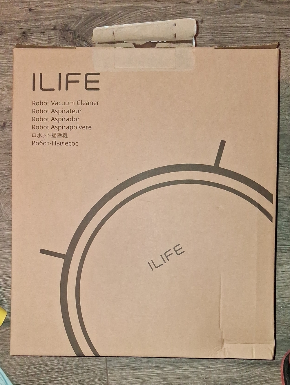 Robot Vacuum Cleaner in Brown Packaging